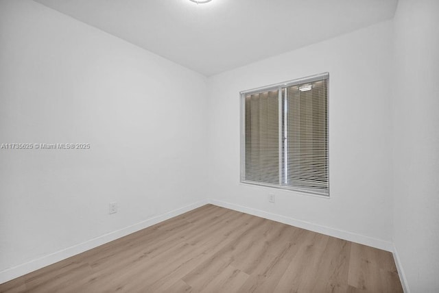 unfurnished room with light hardwood / wood-style floors