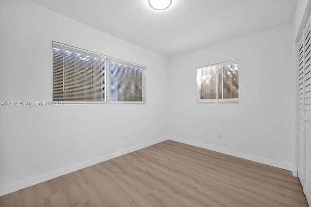 spare room with light wood-type flooring