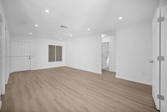 unfurnished room with light hardwood / wood-style floors