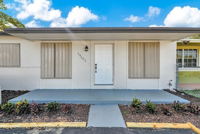 doorway to property with covered porch