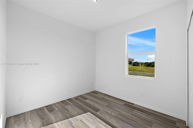 empty room with wood-type flooring