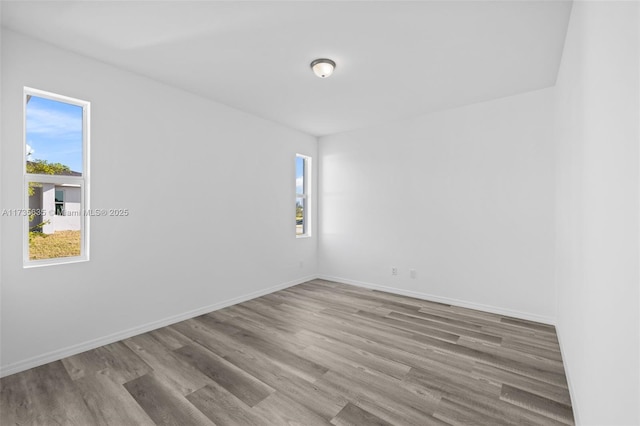 unfurnished room featuring wood-type flooring