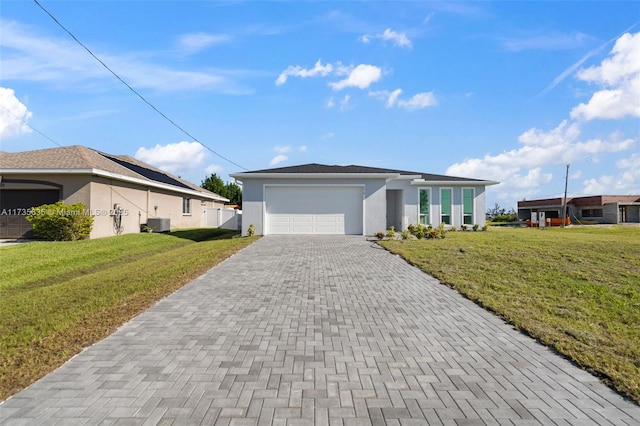 ranch-style home with a garage and a front lawn