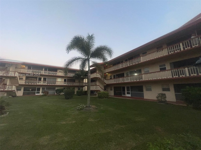 view of outdoor building at dusk