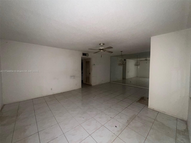 unfurnished room with ceiling fan