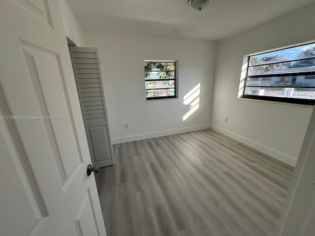 unfurnished bedroom featuring light wood-type flooring