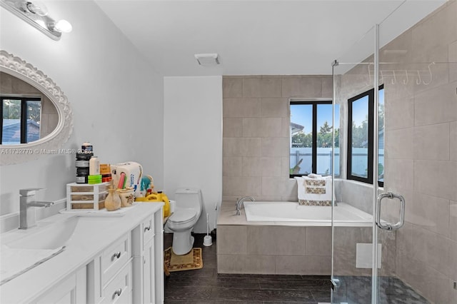 full bathroom featuring hardwood / wood-style floors, independent shower and bath, vanity, toilet, and a water view