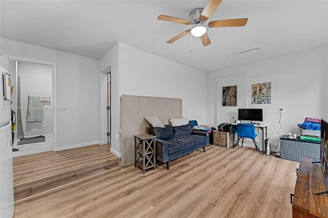 living area featuring ceiling fan and light wood-type flooring