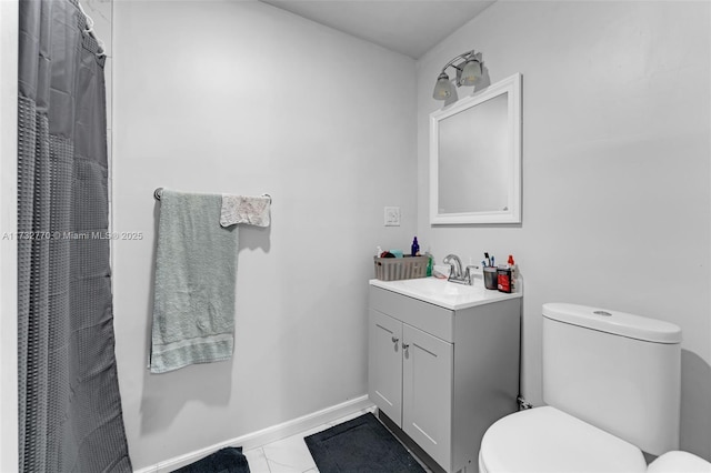 bathroom featuring walk in shower, vanity, and toilet