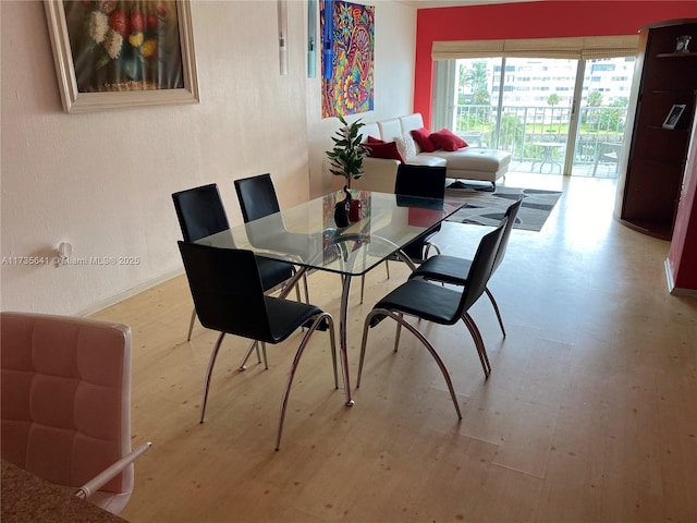 dining space featuring hardwood / wood-style flooring