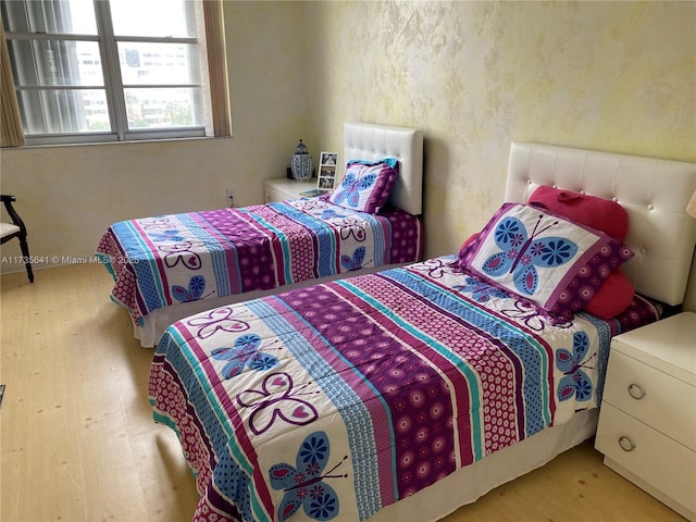 bedroom with light wood-type flooring