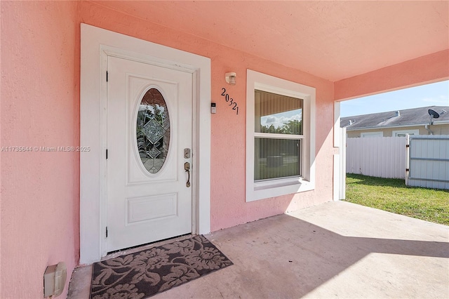 doorway to property with a patio area