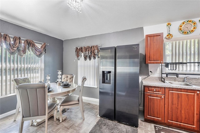 dining area with vaulted ceiling and a textured ceiling