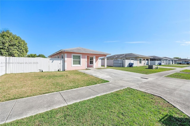 single story home with a front yard