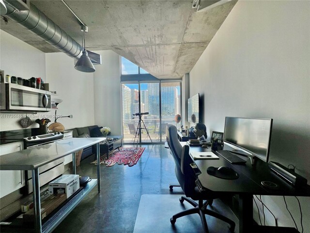 kitchen with white cabinetry, sink, decorative light fixtures, and appliances with stainless steel finishes