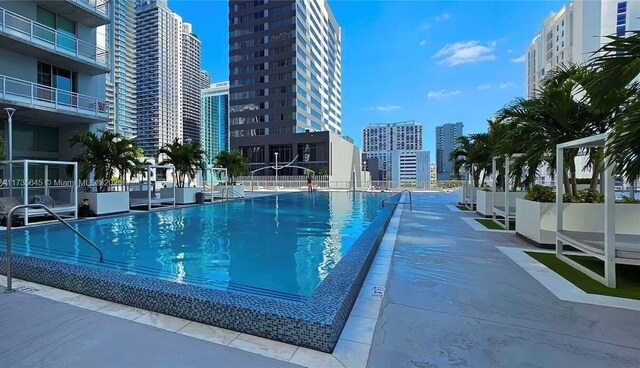 view of swimming pool with a patio area