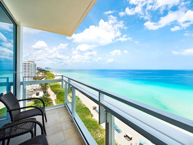 balcony featuring a water view