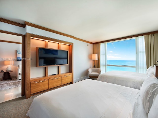 carpeted bedroom with crown molding