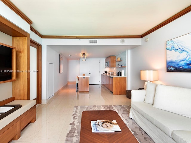 living room featuring light tile patterned floors and ornamental molding