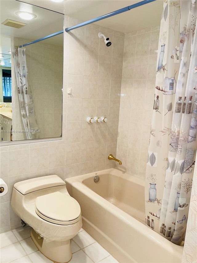 bathroom featuring tile patterned flooring, toilet, tile walls, and shower / tub combo with curtain