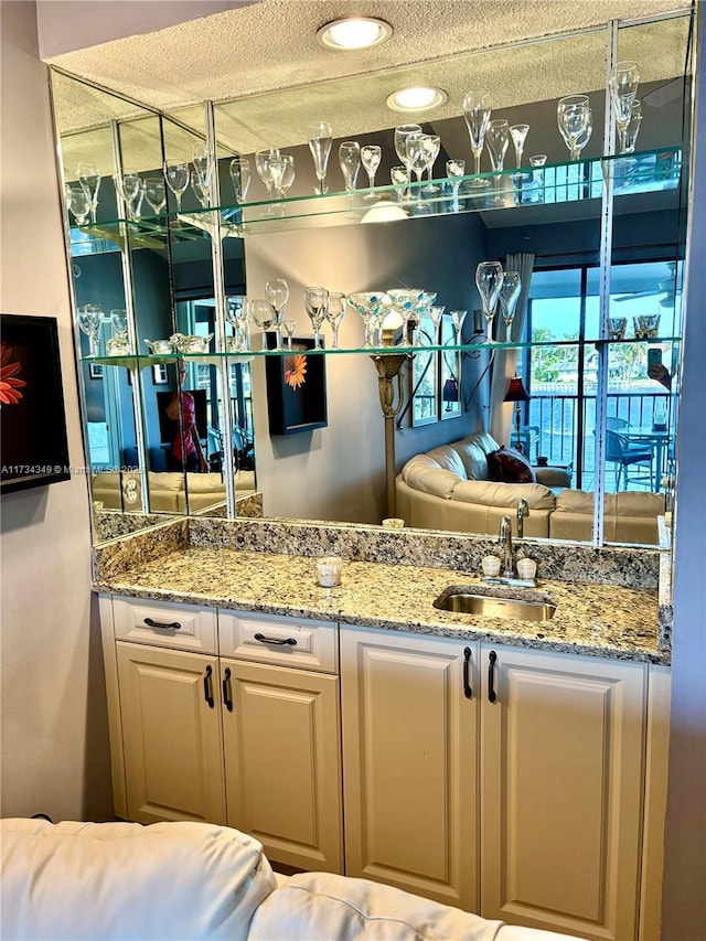 bathroom with sink and a textured ceiling