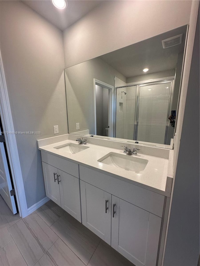 bathroom with vanity and walk in shower