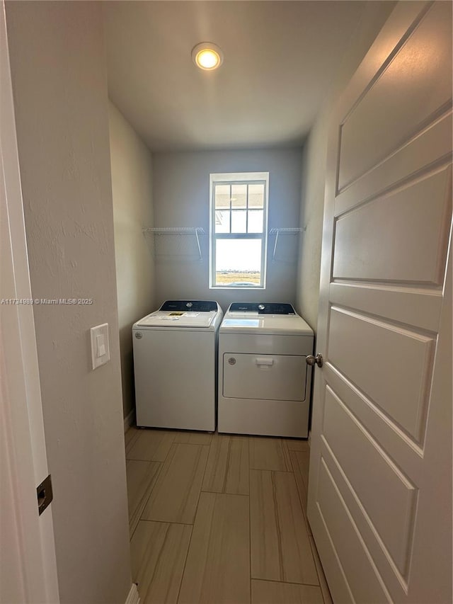 laundry area with washing machine and clothes dryer