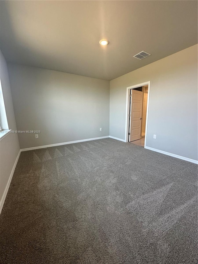 spare room featuring carpet