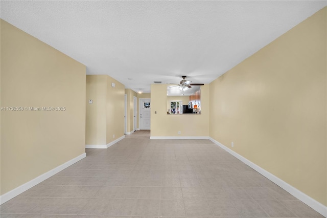 unfurnished living room featuring a textured ceiling and ceiling fan