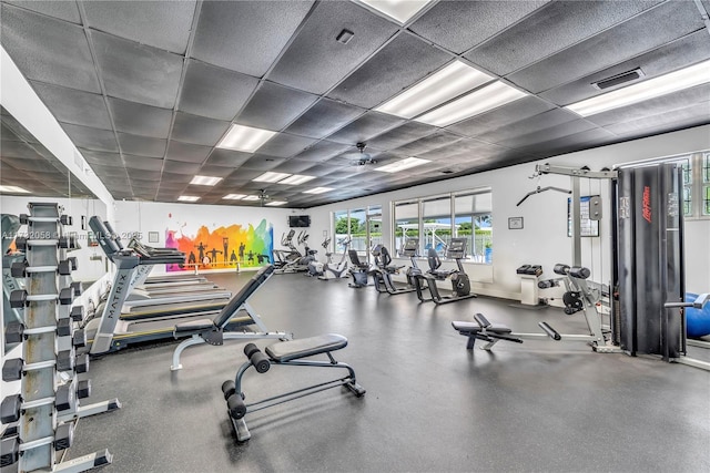 gym featuring a drop ceiling