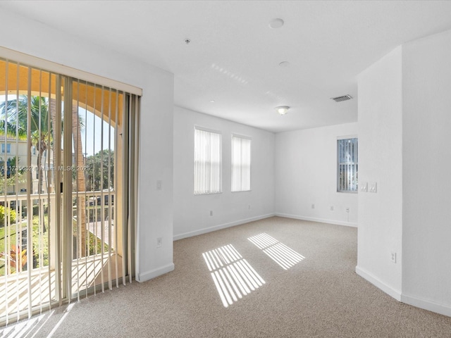 spare room featuring carpet flooring