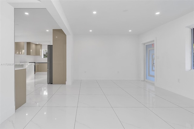 empty room with light tile patterned floors