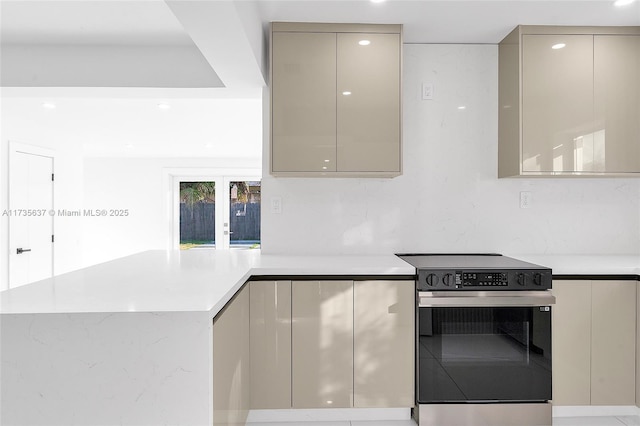 kitchen with electric stove and french doors