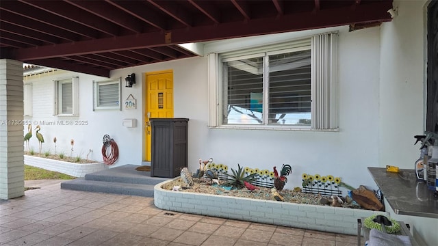 entrance to property with a patio area