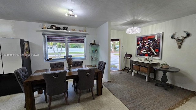 dining area with a notable chandelier