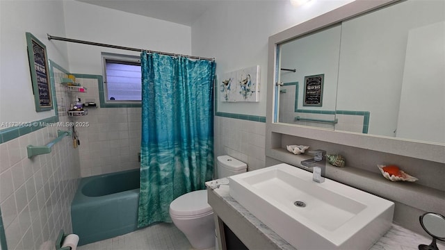 full bathroom with tile walls, vanity, toilet, and shower / bathtub combination with curtain