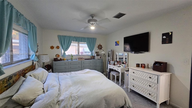 carpeted bedroom featuring ceiling fan