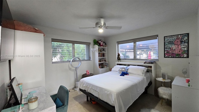 carpeted bedroom with ceiling fan