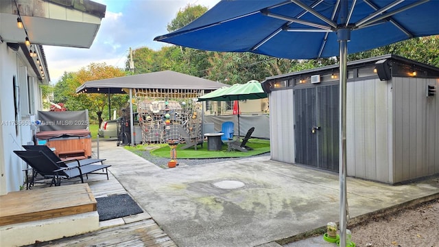 view of patio featuring a storage unit