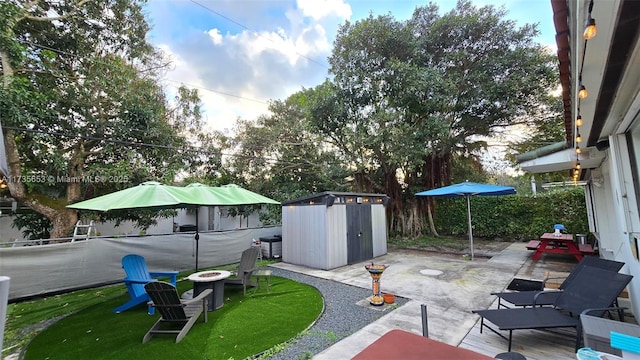 view of patio / terrace with a storage shed