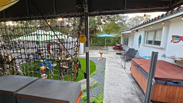 view of patio with a hot tub