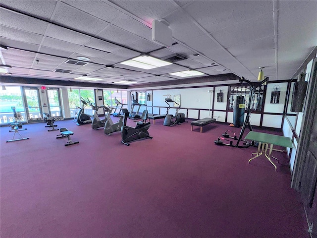 workout area featuring a drop ceiling