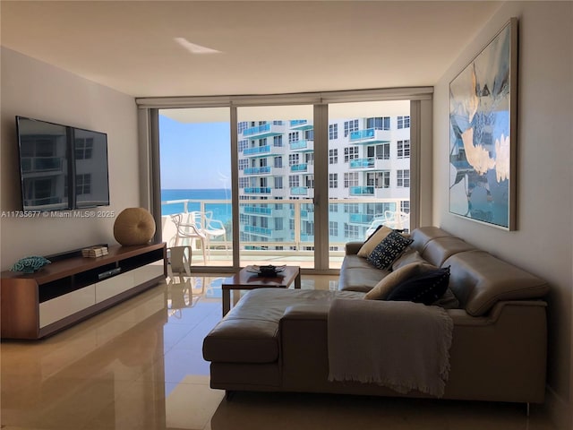 living room featuring expansive windows and tile patterned floors