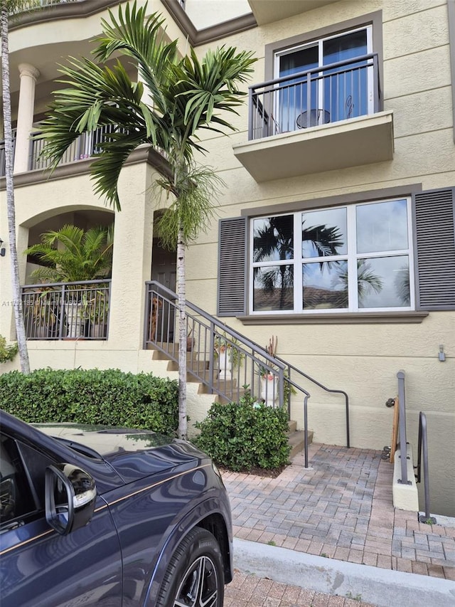 doorway to property featuring a balcony