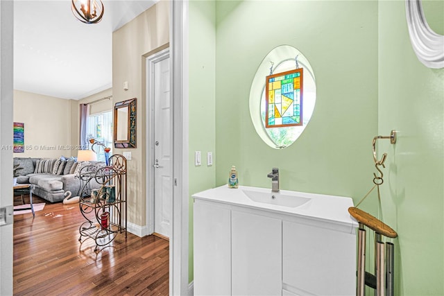 bathroom with wood-type flooring and vanity