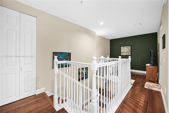 hallway with dark hardwood / wood-style floors