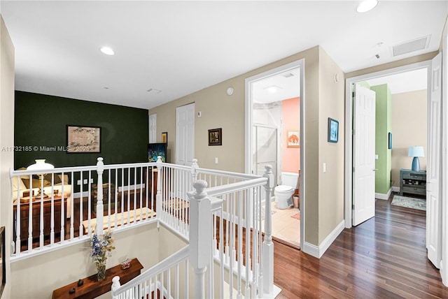 hall with dark hardwood / wood-style floors