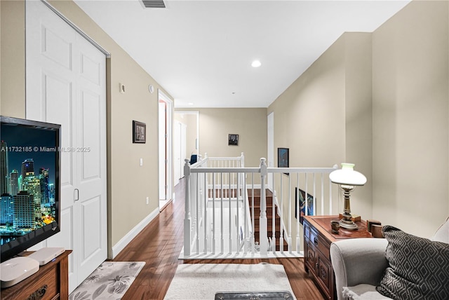 hall with dark wood-type flooring