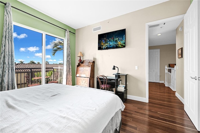 bedroom with access to outside and dark hardwood / wood-style flooring