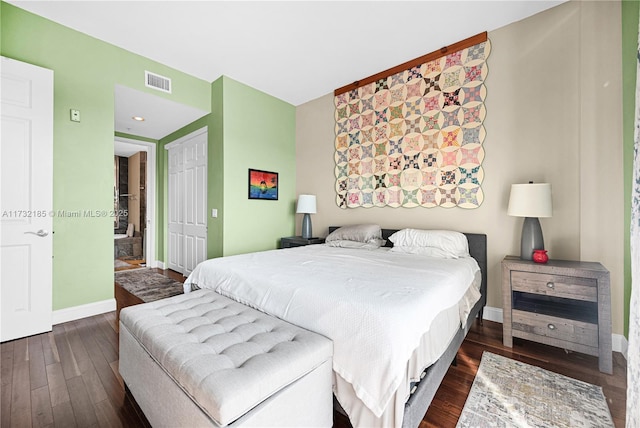 bedroom with dark wood-type flooring